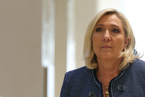 President of the parliamentary group of the French far-right Rassemblement National (RN) party, Marine Le Pen arrives at the Paris courthouse for her trial verdict on suspicion of embezzlement of European public funds, in Paris, on March 31, 2025.
