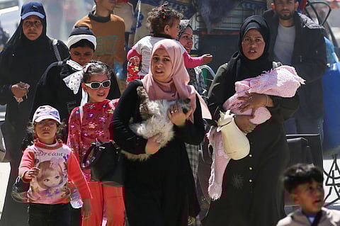 People fleeing Rafah arrive in Khan Yunis city following new Israeli evacuation orders, in the southern Gaza Strip, on March 31, 2025.