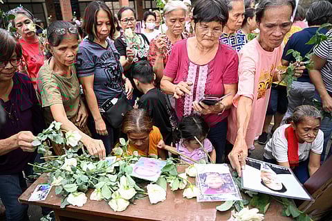 Families of victims of former Philippines president Rodrigo Duterte's "war on drugs" take part in a thanksgiving mass at a church in Manila on March 31, 2025, weeks after Duterte was arrested and brought to the International Criminal Court (ICC) in The Hague.