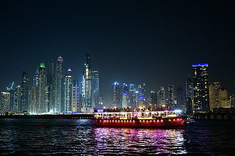 File photo: A boat ferries passengers past the Dubai Marina.