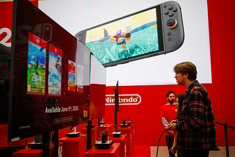 A guest plays with the new Nintendo Switch 2 video-game console system of Japan's Nintendo during the worldwide presentation at the Grand Palais in Paris on April 2, 2025.