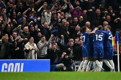 Chelsea's Ecuadorian midfielder Moises Caicedo celebrates with teammates after scoring his team second goal during the English Premier League football match against Tottenham Hotspur at Stamford Bridge in London on April 3.