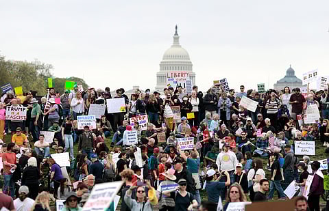 Protesters attend a "Hands Off" rally to demonstrate against Trump on the National Mall on April 5, 2025 in Washington, DC. Protests against Trump administration policies and Elon Musk's Department of Government Efficiency (DOGE) are being held nationwide in what organisers are calling a National Day of Action.