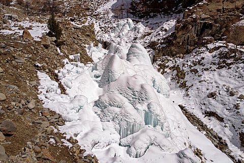This aerial photograph taken on March 18, 2025 shows an artificial glacier built by local residents during winters to conserve water for the summers at Pari village in Kharmang district, in Pakistan's mountainous Gilgit-Baltistan region.