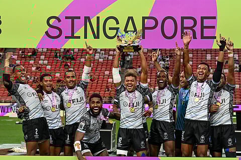 Fiji’s team celebrate after winning the men’s cup final against Kenya at the HSBC Rugby Sevens Singapore tournament at the National Stadium in Singapore on April 6.