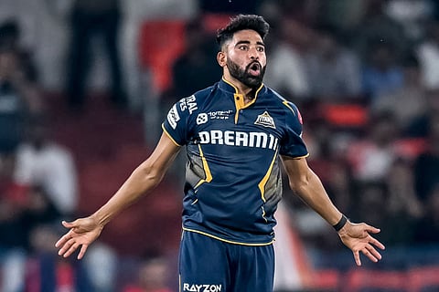 Gujarat Titans' Mohammed Siraj celebrates after taking the wicket of Sunrisers Hyderabad's Simarjeet Singh during the Indian Premier League match in Hyderabad on Sunday.