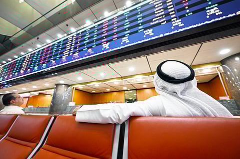 Kuwaiti traders follow the stock market activity at Boursa Kuwait