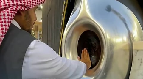 A Saudi official perfumes the Black Stone set into the corner of the Holy Kaaba in the Grand Mosque.
