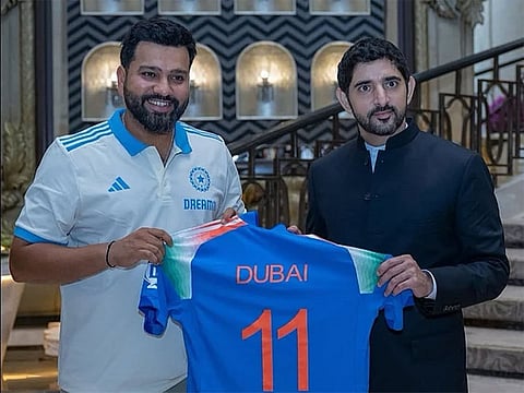 Sheikh Hamdan holds the Team India jersey branded 'Dubai 11' along with Indian skipper Rohit Sharma in Mumbai