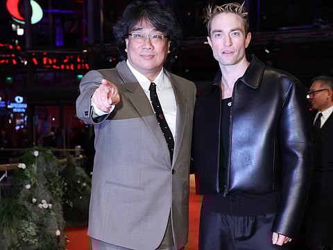 English actor Robert Pattinson (R) and South Korean director Bong Joon Ho at 75th Berlinale