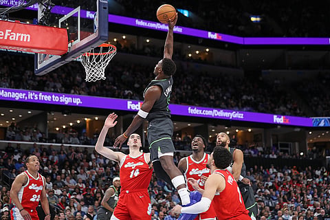 Anthony Edwards goes strong to the basket against Zach Edey and the rest of the Grizzlies defenders.