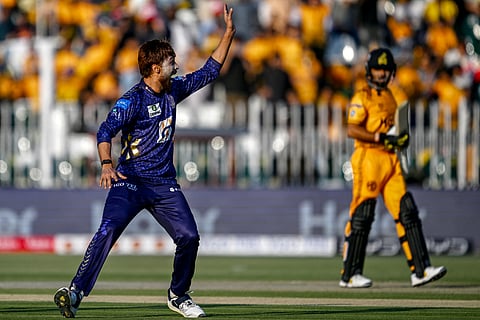 Quetta Gladiators' Mohammad Amir (left) celebrates after dismissing Peshawar Zalmi's Babar Azam (right) during the Pakistan Super League (PSL) Twenty20 match in Rawalpindi on Saturday.