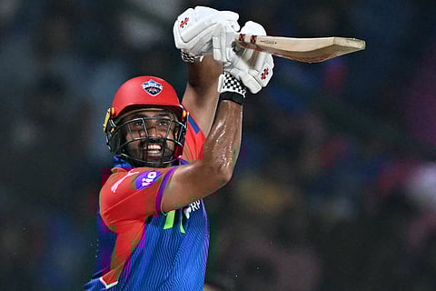 Delhi Capitals' Karun Nair watches the ball after playing a shot during the Indian Premier League (IPL) Twenty20 cricket match against Mumbai Indians at the Arun Jaitley Stadium in New Delhi on April 13.