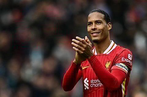 Liverpool's Dutch defender Virgil van Dijk applauds at the end of the English Premier League football match between Liverpool and West Ham United at Anfield in Liverpool, north west England.
