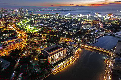 A view of the City of Manila, with the Pasig River in the foreground and Manila Bay in the backdrop.