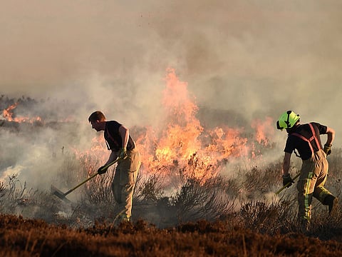 Firefighters tackle a wildfire in the Mourne Mountains, County Down, Northern Ireland.