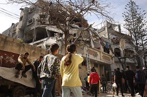 Palestinians check the damage following overnight Israeli strikes on a residential neighbourhood in Jabalia's southwestern district of Nazla in the northern Gaza Strip on April 16, 2025.