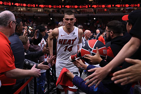 Tyler Herro #14 of the Miami Heat interacts with fans after defeating the Chicago Bulls during an NBA play-in tournament game at the United Centerin Chicago, Illinois.