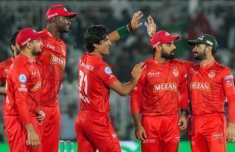 Islamabad United players celebrate a wicket of Multan Sultans in the Pakistan Super League match on Wednesday.