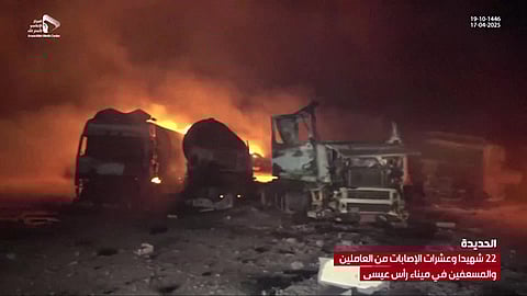 This grab taken from footage released by Al Masirah TV station of Yemen's Houthis shows fire and destruction at the site of US strikes on the Ras Issa fuel port in western Yemen on April 18, 2025.