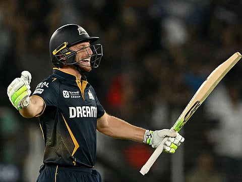 Gujarat Titans' Jos Buttler celebrates after winning the Indian Premier League (IPL) Twenty20 match against Delhi Capitals in Ahmedabad on Saturday.