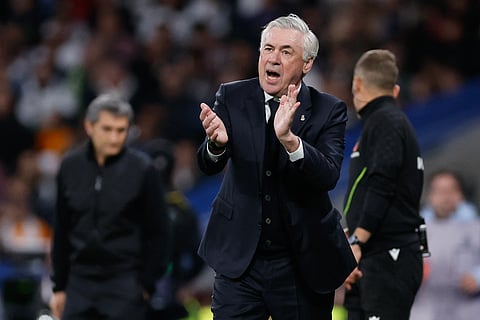 Real Madrid's Italian coach Carlo Ancelotti gestures to players during the Spanish league match at Santiago Bernabeu Stadium in Madrid.
