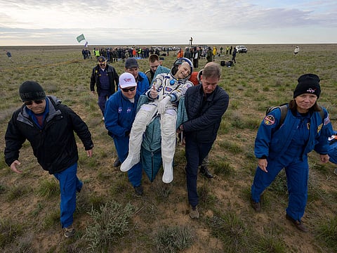 NASA astronaut Don Pettit (C) being carried to a medical tent shortly after he, and Roscosmos cosmonauts Alexey Ovchinin and Ivan Vagner landed in their Soyuz MS-26 spacecraft near the town of Zhezkazgan, Kazakhstan.