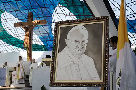 An image of Pope Francis is displayed during a mass in his honor following the Vatican's announcement of his death at the Cathedral of Brasilia on April 21, 2025.