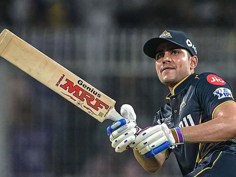Gujarat Titans' captain Shubman Gill watches the ball after playing a shot during the Indian Premier League (IPL) Twenty20 cricket match between Kolkata Knight Riders and Gujarat Titans at the Eden Gardens in Kolkata on April 21, 2025.