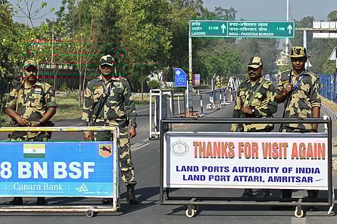 Indian Border Security Force (BSF) soldiers stand guard at the entrance of the India-Pakistan Wagah border post, about 35kms from Amritsar on April 24, 2025.