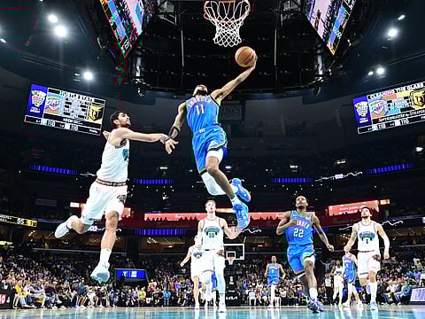 Isaiah Joe of the Oklahoma City Thunder drives to the basket during the game against the Memphis Grizzlies