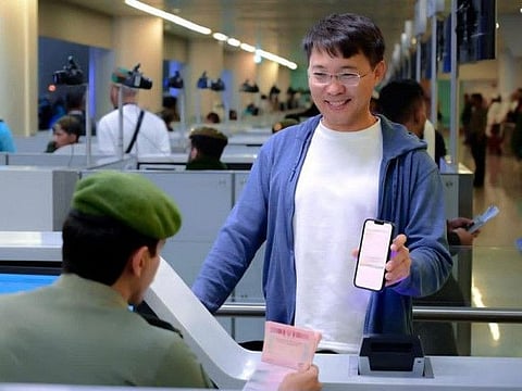 Holders of recently launched transit visas arrive at Saudi airport.