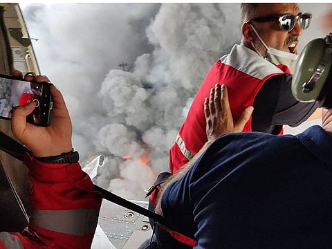 Members of a rescue team arriving by helicopter at the scene of an explosion that took place a day earlier at the Shahid Rajaee port dock southwest of Bandar Abbas in the Iranian province of Hormozgan.
