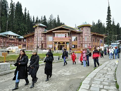Tourists take a stroll after taking a Gondola Ride at the Gulmarg Ski Resort, days after the Pahalgam terror attack that left 26 tourists dead, in Gulmarg on Saturday.