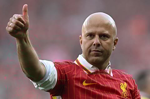 Liverpool's Dutch manager Arne Slot waves to the fans after the English Premier League football match against Tottenham Hotspur at Anfield in Liverpool, north west England on April 27.