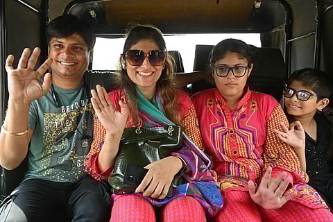 Pakistani citizen Savita Kumari (2L) and her children of Indian nationality are received by her husband Rishi Kumar Jisrani (L), an Indian citizen, upon their arrival from Pakistan at the India-Pakistan Wagah border post, about 35kms from Amritsar on April 29, 2025, after India approved stay of NORI (No Obligation to Return to India) visa holders from Pakistan.