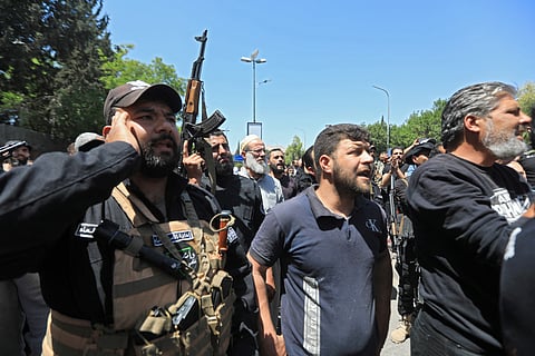People chant slogans during the funeral of a man in the capital Damascus on April 29, 2025, who was killed during overnight sectarian clashes that left nine people including six Druze fighters dead.