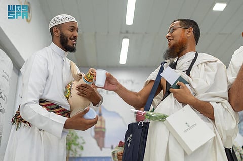 A Hajj pilgrim is being welcomed upon arriving at the King Abdulaziz airport in Jeddah en route to Mecca.