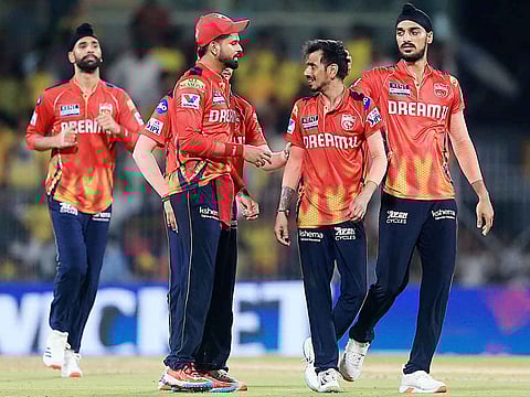 Punjab Kings' captain Shreyas Iyer and teammates Yuzvendra Chahal and Arshdeep Singh celebrate the dismissal of Chennai Super Kings' captain MS Dhoni during their IPL 2025 match, at MA Chidambaram Stadium in Chennai on Wednesday.