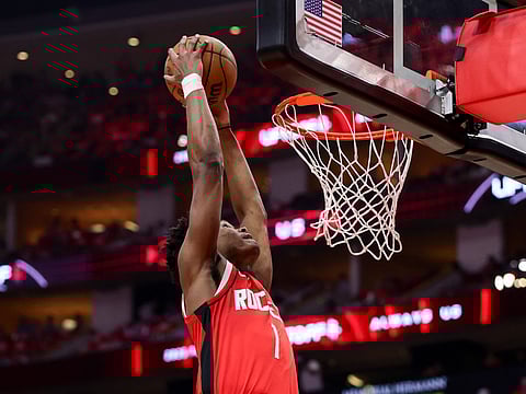 Amen Thompson of the Houston Rockets dunks the ball against the Golden State Warriors during the second quarter in Game Five of the Western Conference First Round NBA Playoffs.