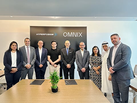 The Omnix and Hyperfusion teams after signing the MoU
