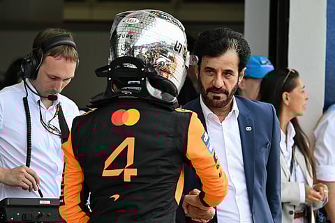 McLaren's British driver Lando Norris with Mohammed Ben Sulayem.