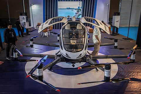 The EHang 216, a Chinese autonomous aerial vehicle (AAV) designed for urban air mobility and equipped with 16 coaxial propellers and which previously conducted test flights, is displayed during the Periklindo Electric Vehicle Show (PEVS) 2025 at Jakarta International Expo Kemayoran in Jakarta on May 3, 2025.