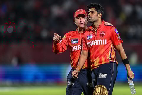 Punjab Kings' head coach Ricky Ponting (left) speaks with team's player Shashank Singh during the Indian Premier League 2025.