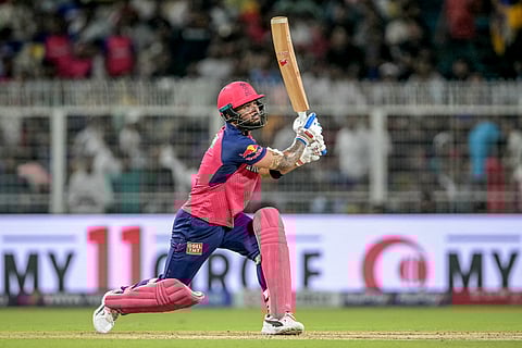 Rajasthan Royals' captain Riyan Parag watches the ball after playing a shot during the Indian Premier League (IPL) Twenty20 cricket match against Kolkata Knight Riders at the Eden Gardens in Kolkata on May 4.