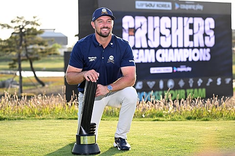 USA's Bryson DeChambeau of Crushers GC celebrates with the trophy after winning the LIV Golf Korea at Jack Nicklaus Golf Club in Incheon on May 4.