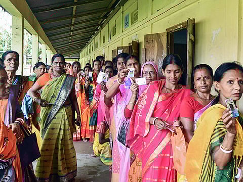 Voters wait in a queue to cast their votes during Assam Panchayat Election, at a Baraigram polling centre in Sribhumi on Friday, May 2, 2025. The Indian government has announced that a caste census will be conducted along with the next population census.