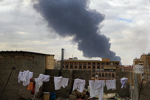 Smoke billows on the horizon following an Israeli air strike on Yemen's Huthi-held capital Sanaa on May 6, 2025.
