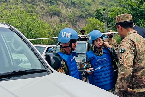UN military observers arrive to inspect the site of a damaged mosque after Indian strikes in Muzaffarabad, the capital of Pakistan-administered Kashmir, on May 7, 2025.