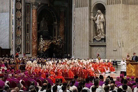 Cardinals attend a mass for the Election of the Roman Pontiff, prior to the start of the conclave, at St Peter’s Basilica in the Vatican on Wednesday.